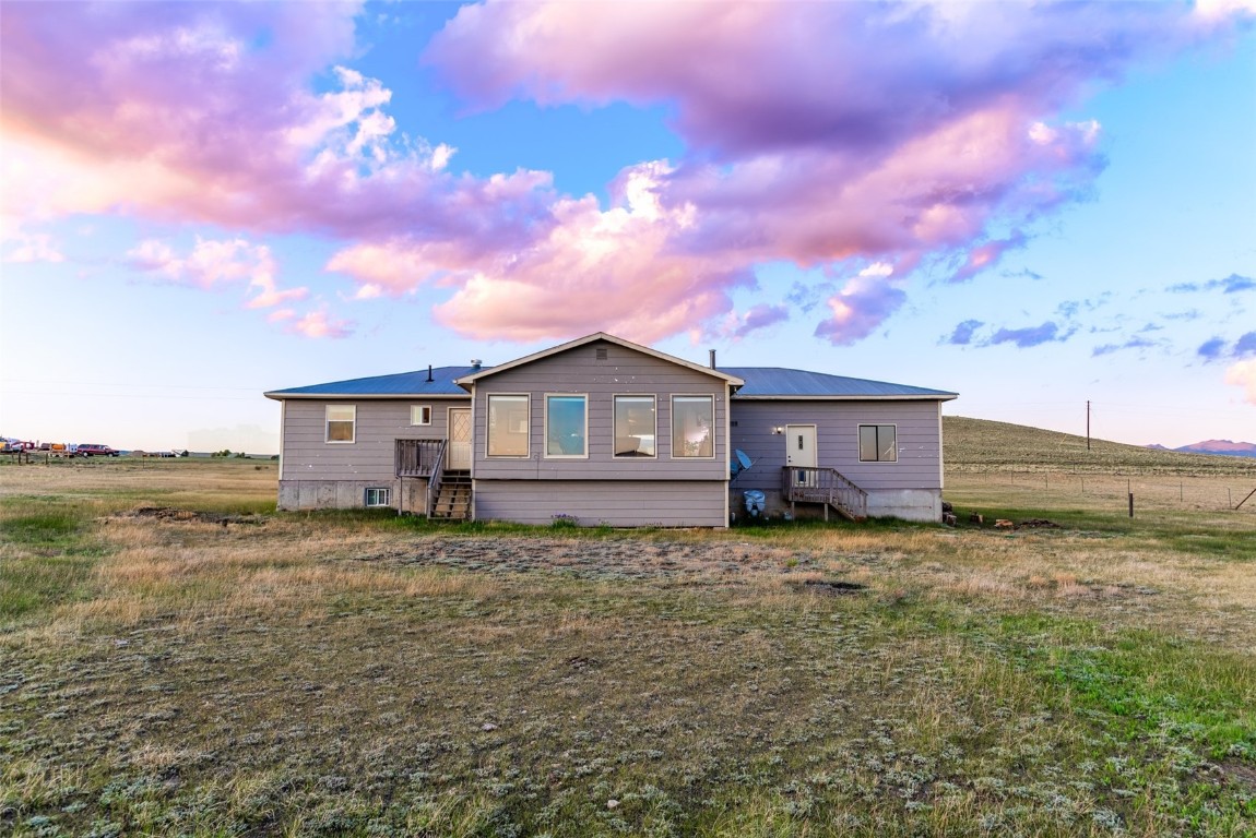 465 Litmer Road Jefferson, CO 80456 - Photo 45 of 50 View of back of house at dusk