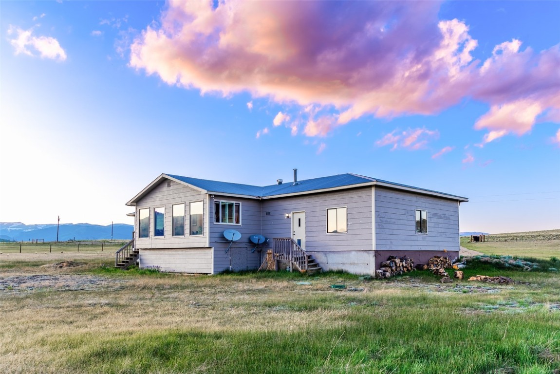 465 Litmer Road Jefferson, CO 80456 - Photo 46 of 50 Back of property at dusk featuring a view of rural / pastoral area