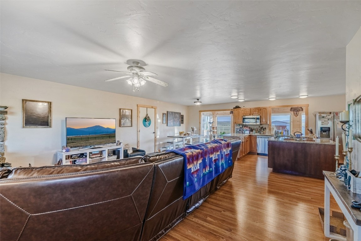 465 Litmer Road Jefferson, CO 80456 - Photo 6 of 50 Living room with wood finished floors and ceiling fan
