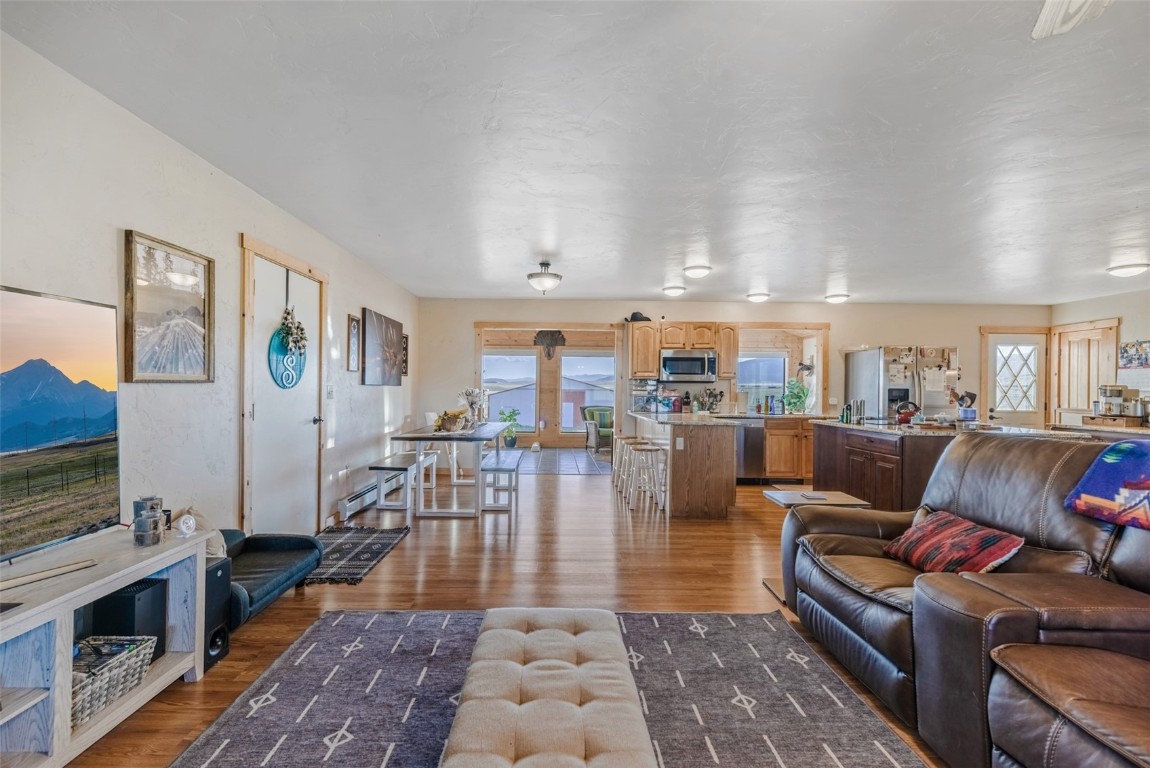 465 Litmer Road Jefferson, CO 80456 - Photo 7 of 50 Living area with wood finished floors