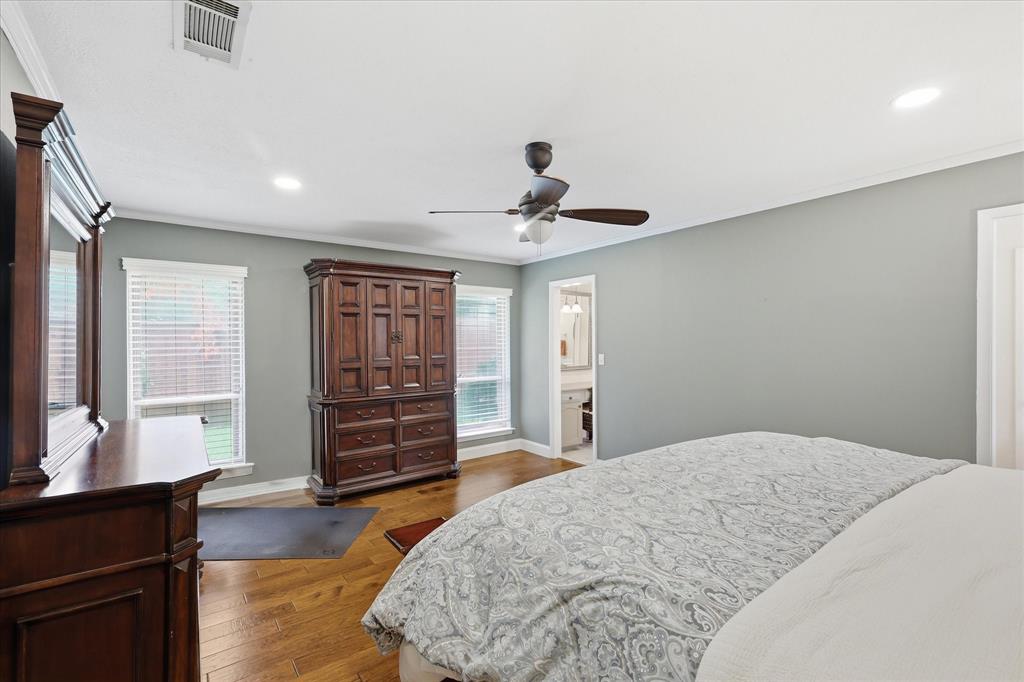 7200 Tamarack Road Benbrook, TX 76116 - Photo 17 of 38 Primary Bedroom with wood-finish flooring throughout and plenty of room for a sitting area.