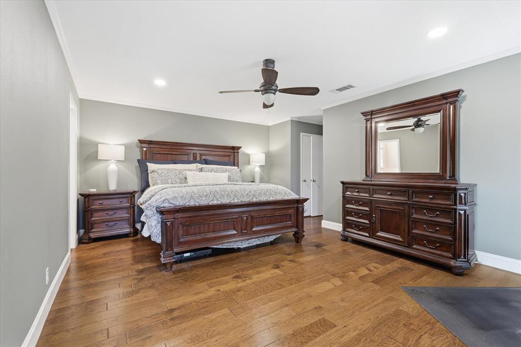 7200 Tamarack Road Benbrook, TX 76116 - Photo 18 of 38 Spacious primary bedroom room with wood-finish flooring and recessed lighting.