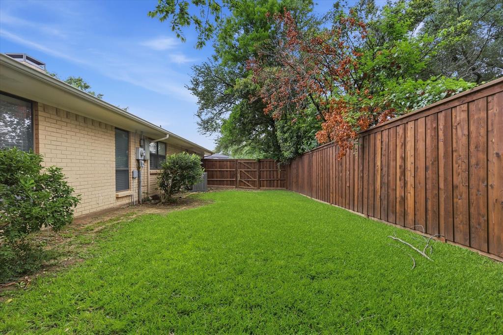 7200 Tamarack Road Benbrook, TX 76116 - Photo 33 of 38 Side yard featuring new privacy fencing, and mature perimeter trees.