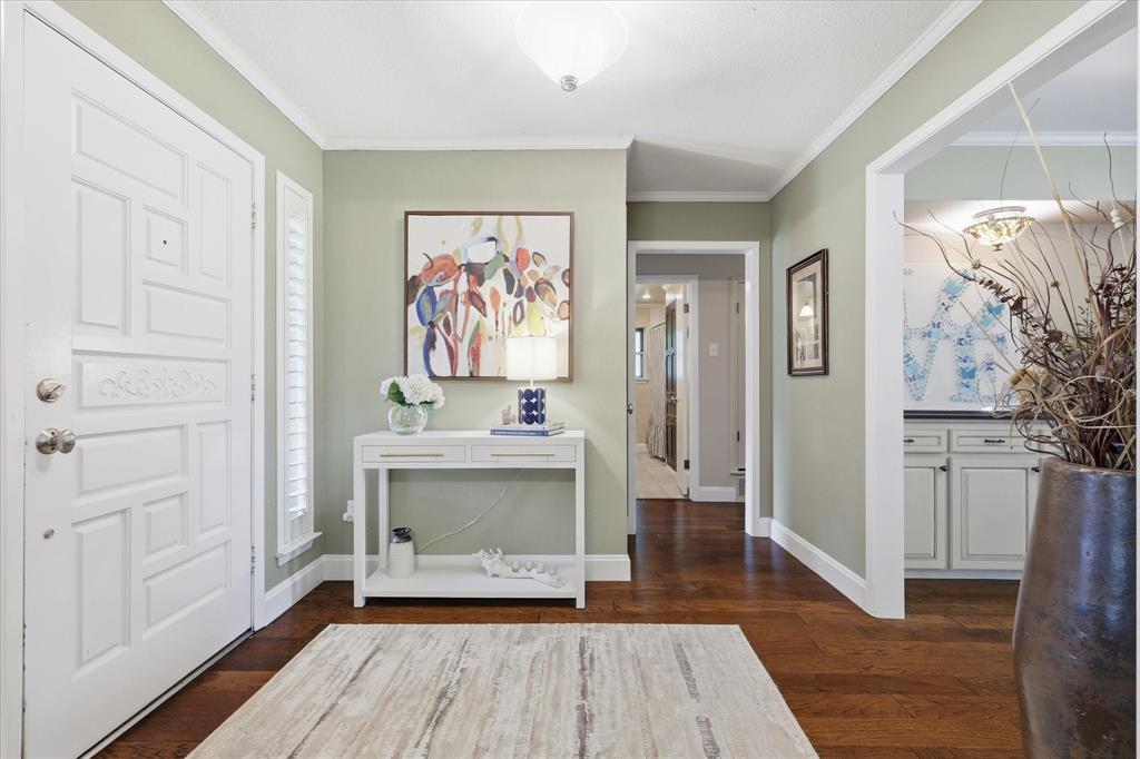 7200 Tamarack Road Benbrook, TX 76116 - Photo 4 of 38 Entryway featuring a paneled white door, wood-finish flooring.