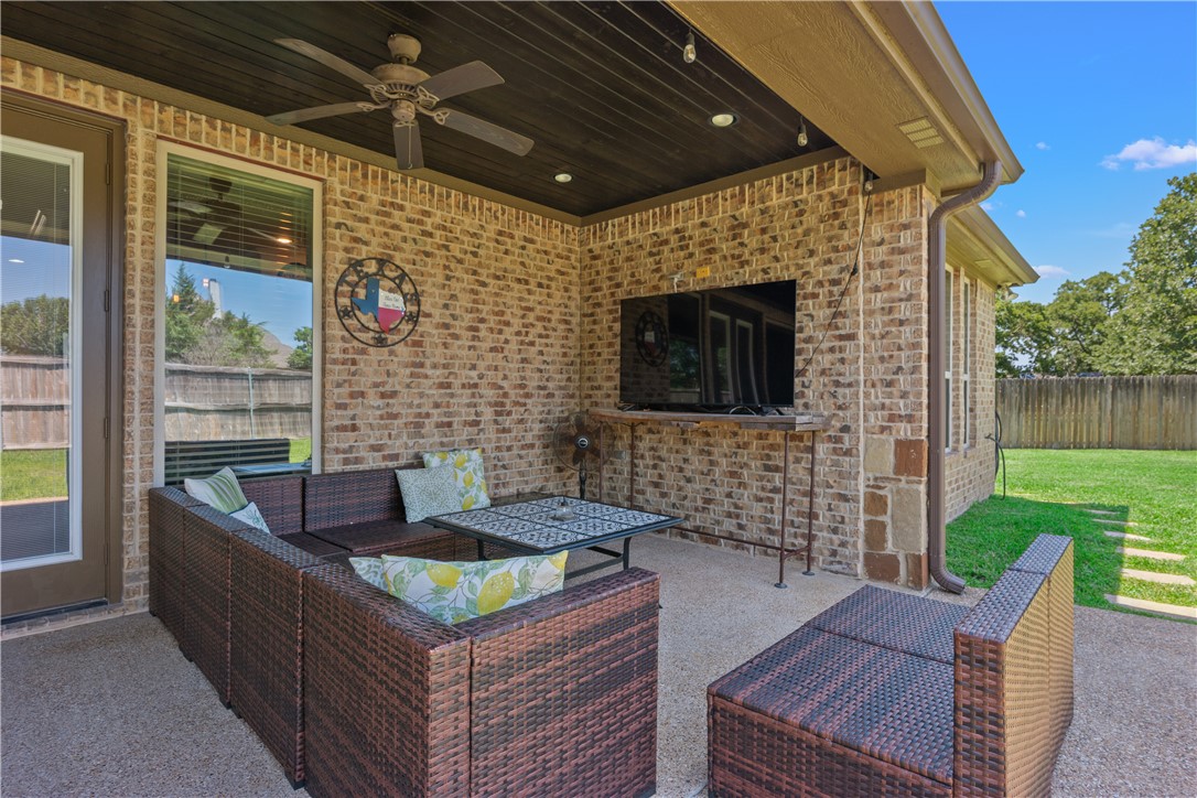 3301 Covington Court Bryan, TX 77808 - Photo 21 of 26 a outdoor living space with furniture and a fireplace