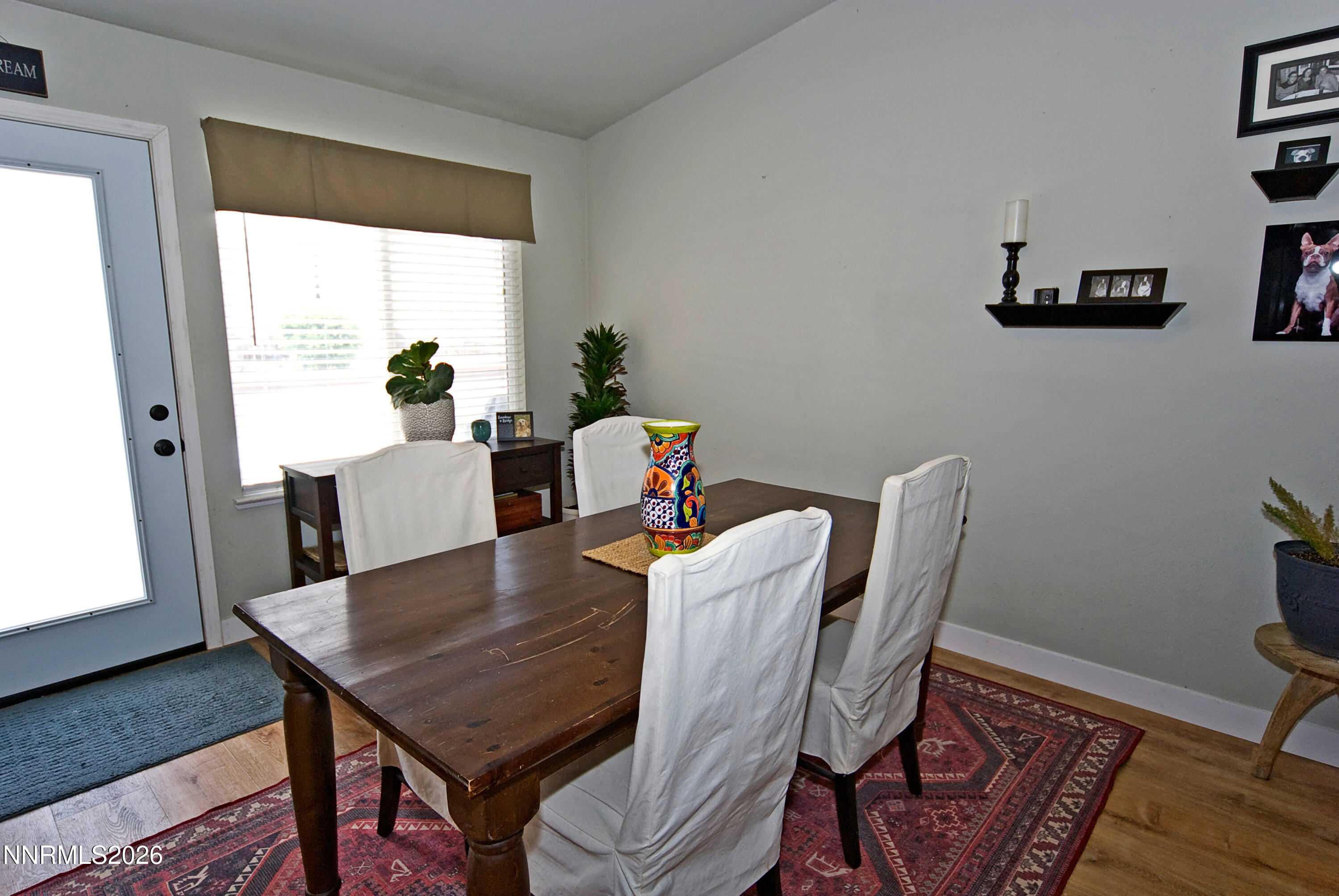 3289 Epic Avenue Reno, NV 89512 - Photo 12 of 32 a view of a dining room with furniture window and wooden floor
