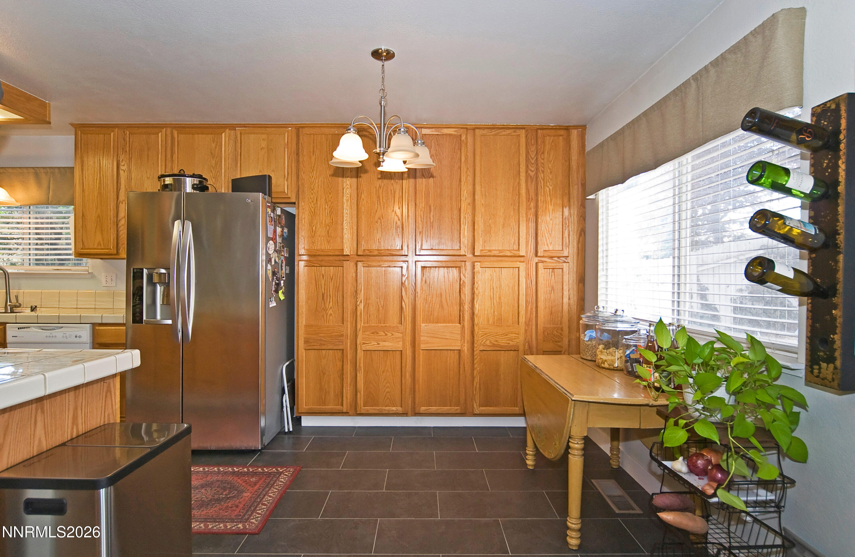 3289 Epic Avenue Reno, NV 89512 - Photo 14 of 32 a view of a kitchen with a refrigerator furniture and a kitchen view