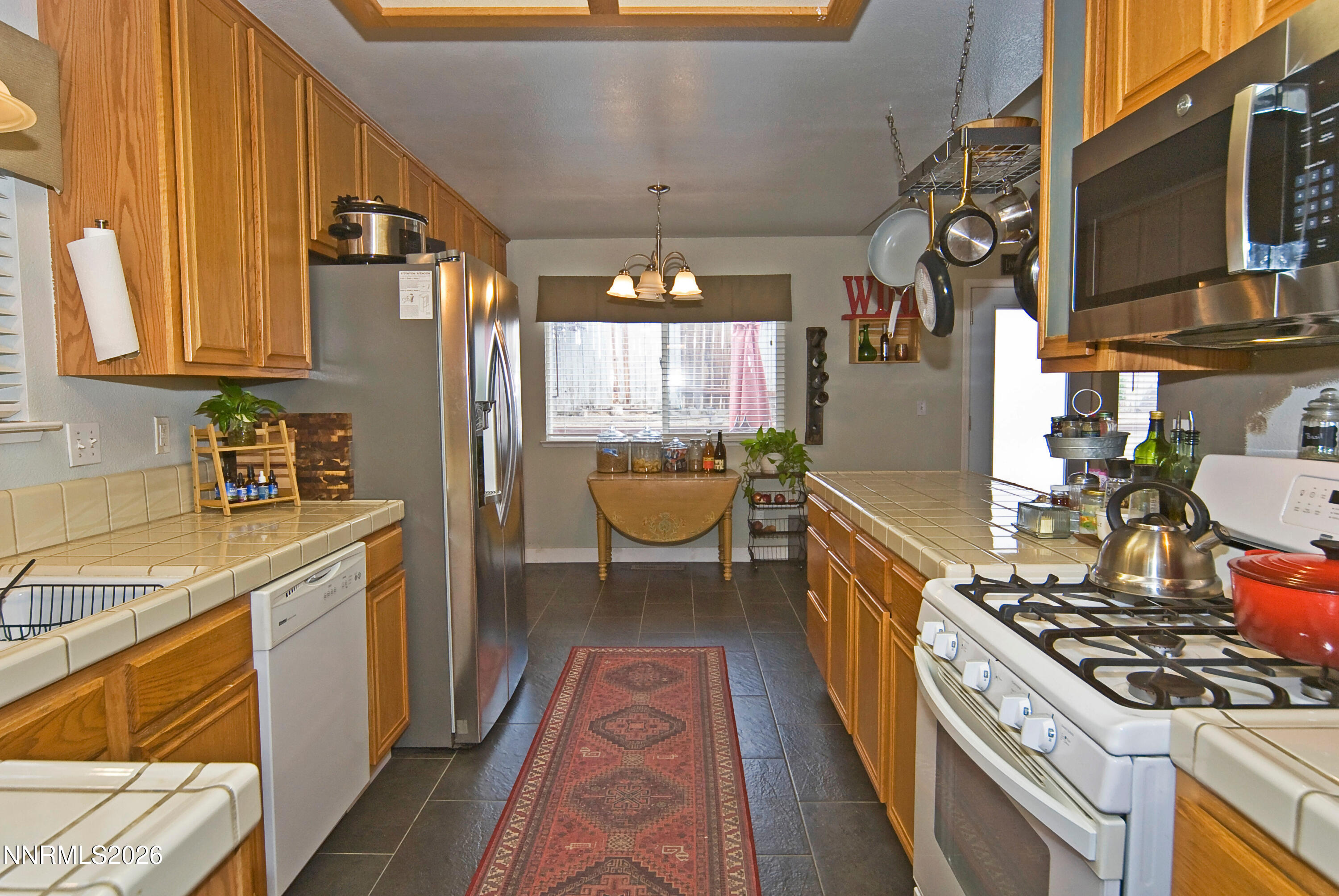 3289 Epic Avenue Reno, NV 89512 - Photo 18 of 32 a kitchen with a stove and a sink