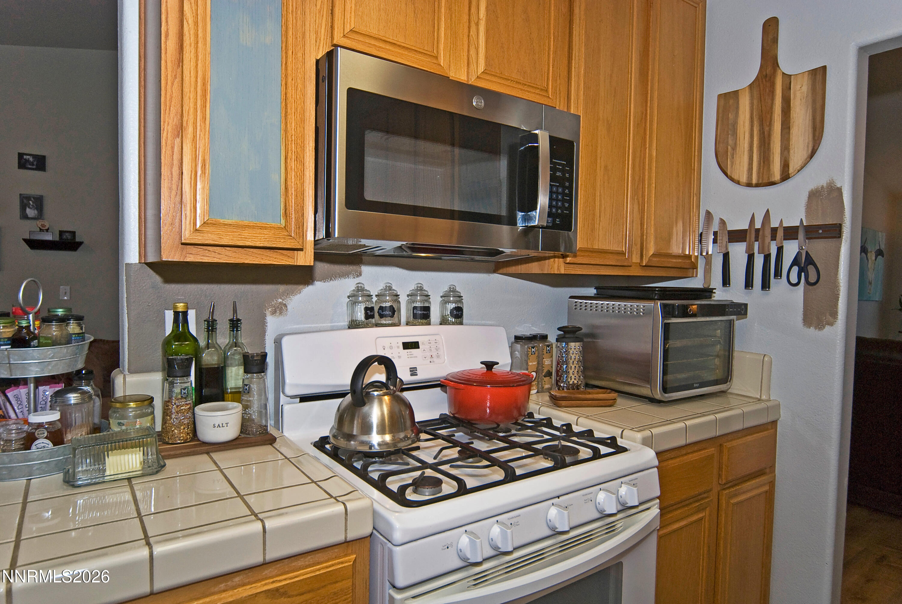 3289 Epic Avenue Reno, NV 89512 - Photo 19 of 32 a kitchen with a stove and a microwave