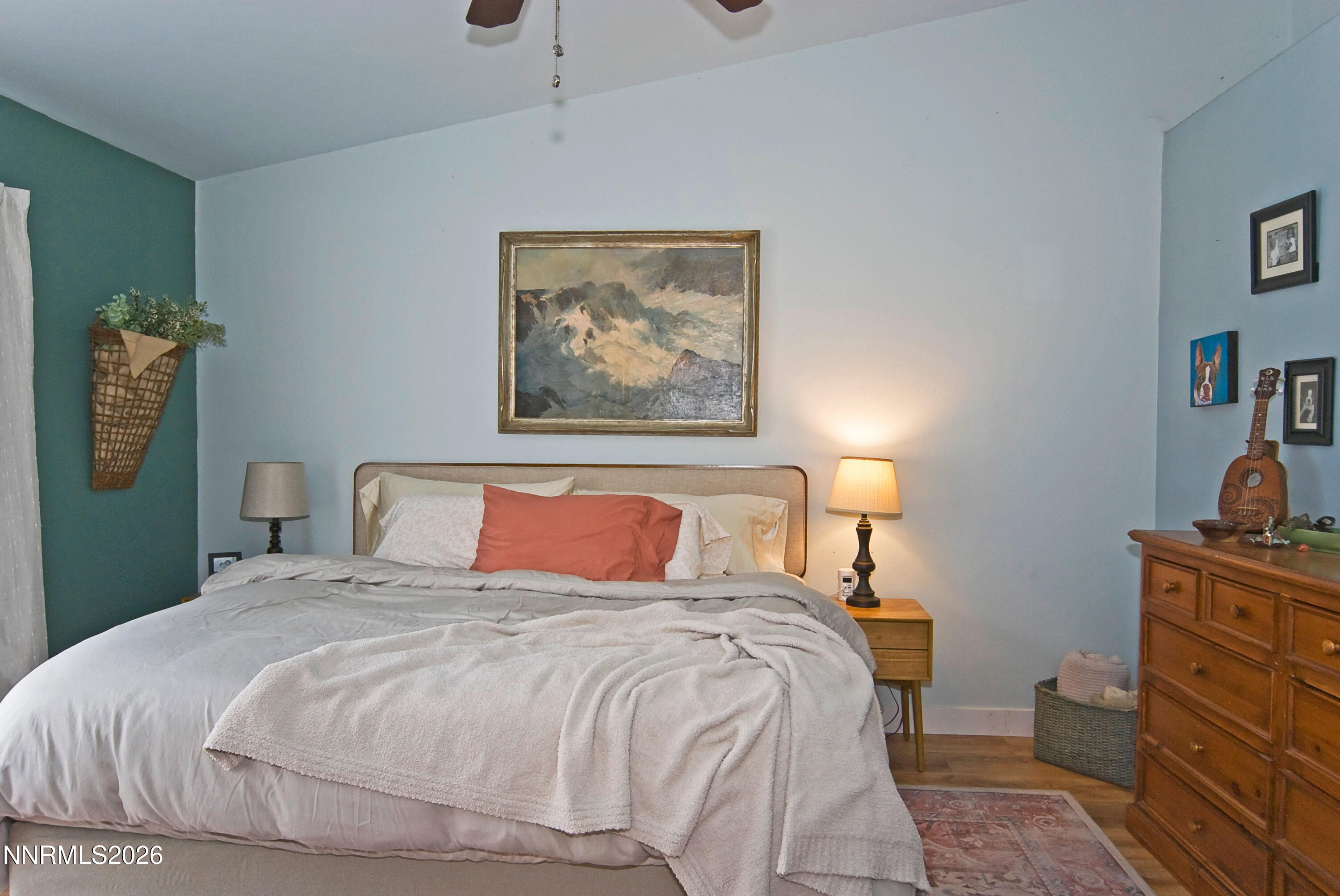 3289 Epic Avenue Reno, NV 89512 - Photo 20 of 32 a bedroom with a bed and a lamp on dresser