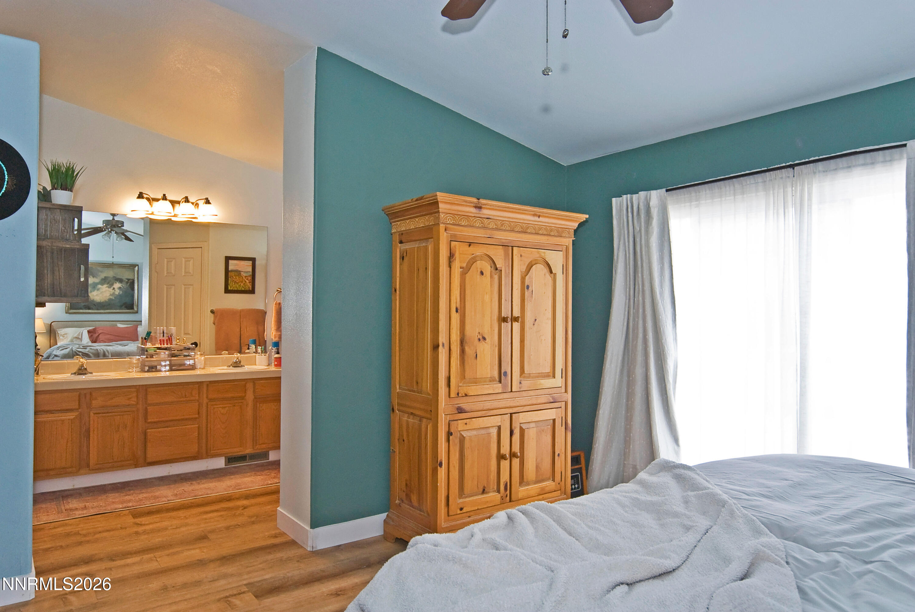 3289 Epic Avenue Reno, NV 89512 - Photo 21 of 32 a bedroom with a bed and a refrigerator