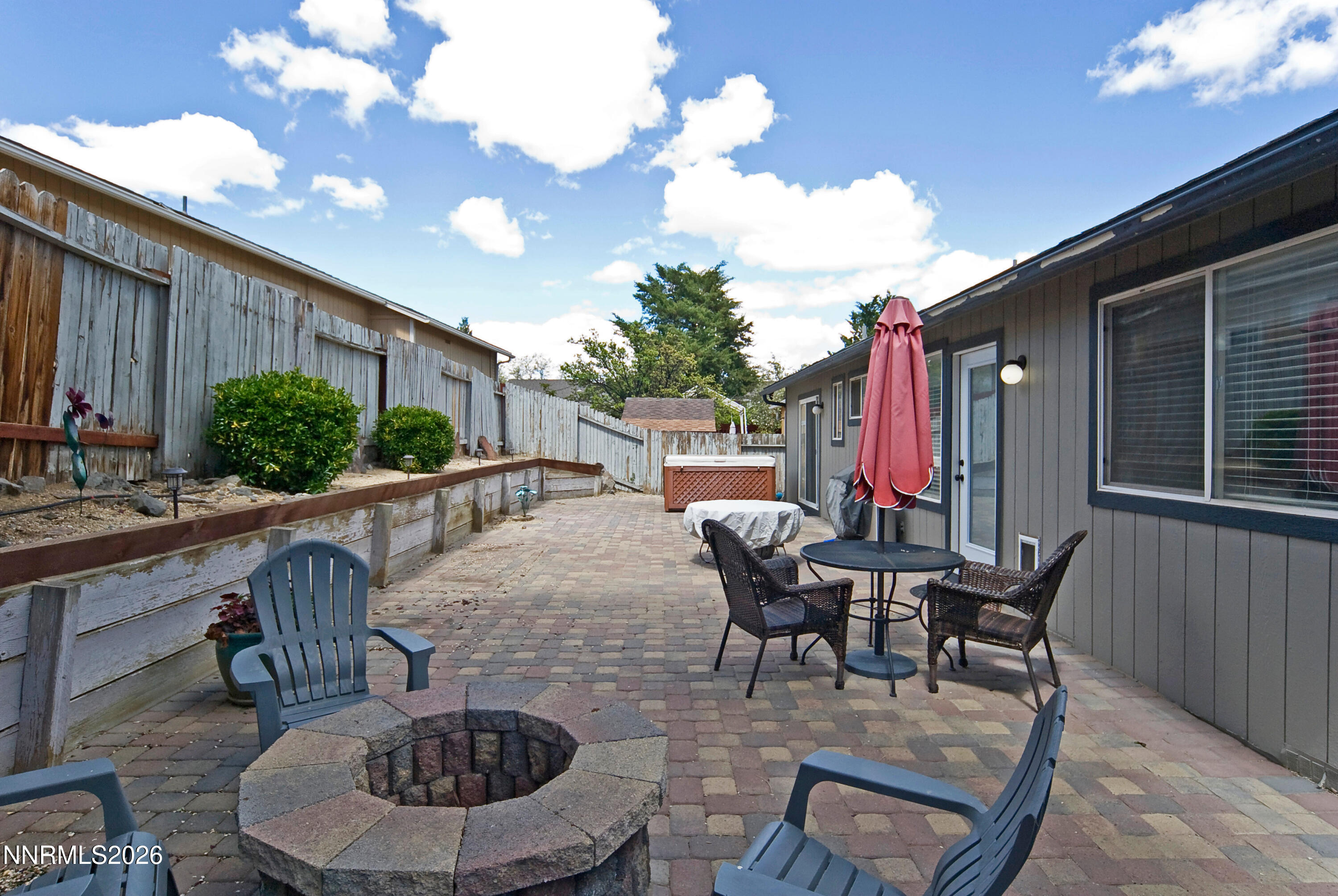 3289 Epic Avenue Reno, NV 89512 - Photo 32 of 32 a patio with table and chairs and potted plants