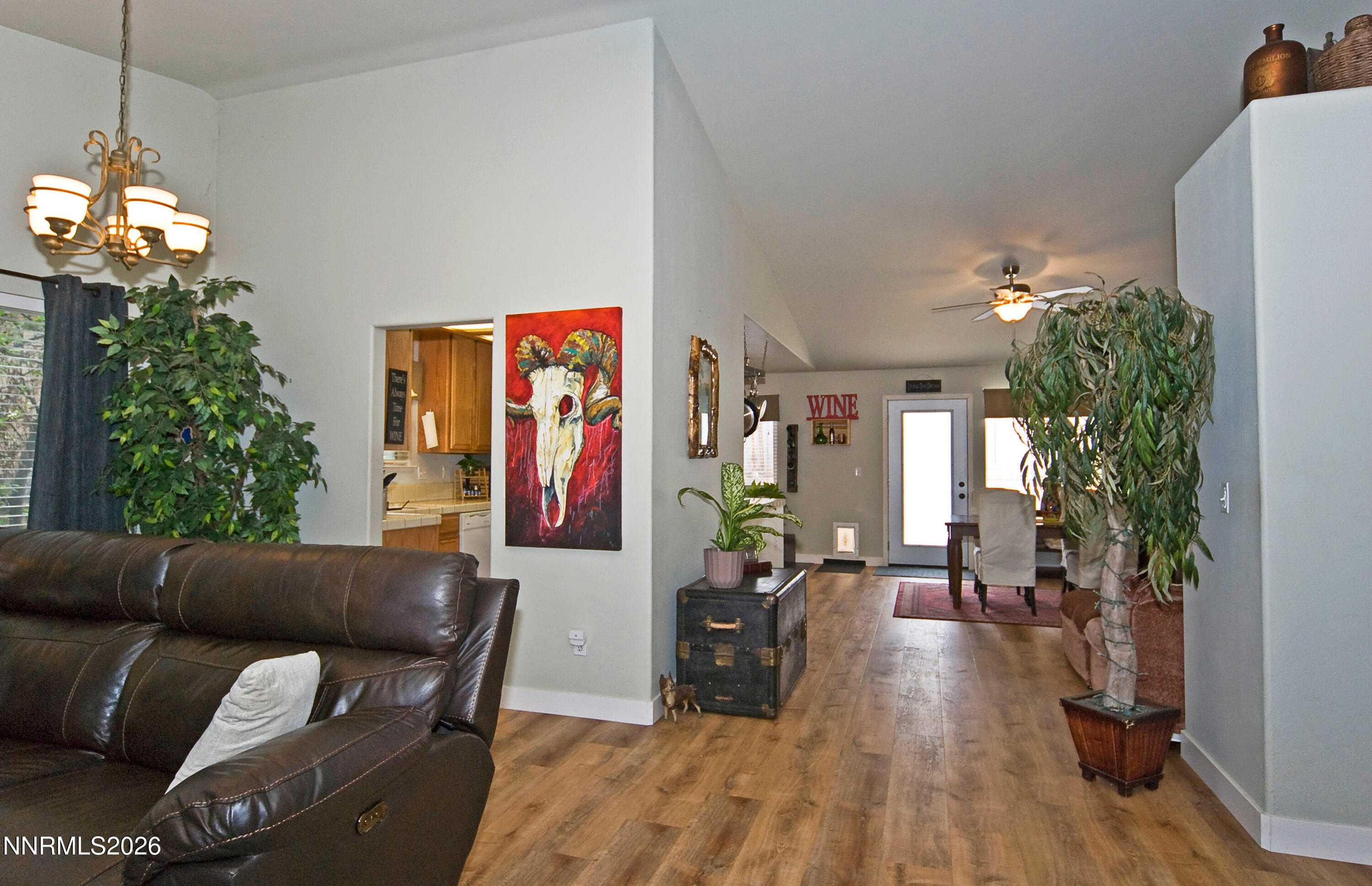 3289 Epic Avenue Reno, NV 89512 - Photo 6 of 32 a living room with furniture a chandelier and a dining room