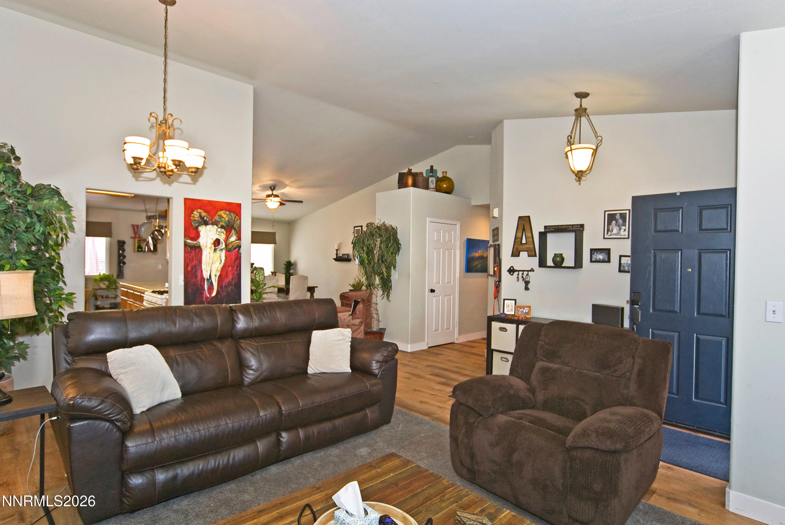 3289 Epic Avenue Reno, NV 89512 - Photo 7 of 32 a living room with furniture chandelier and a chandelier