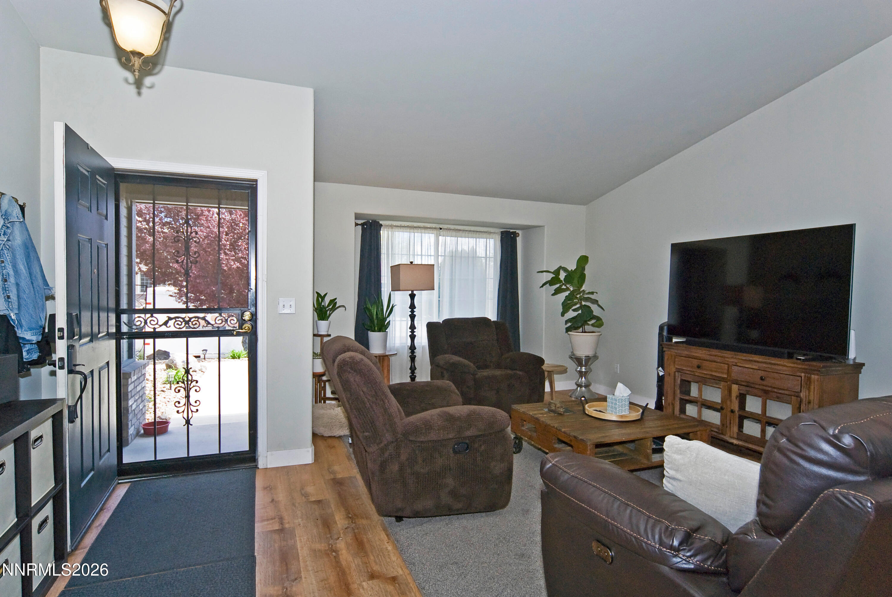3289 Epic Avenue Reno, NV 89512 - Photo 8 of 32 a living room with furniture and a flat screen tv