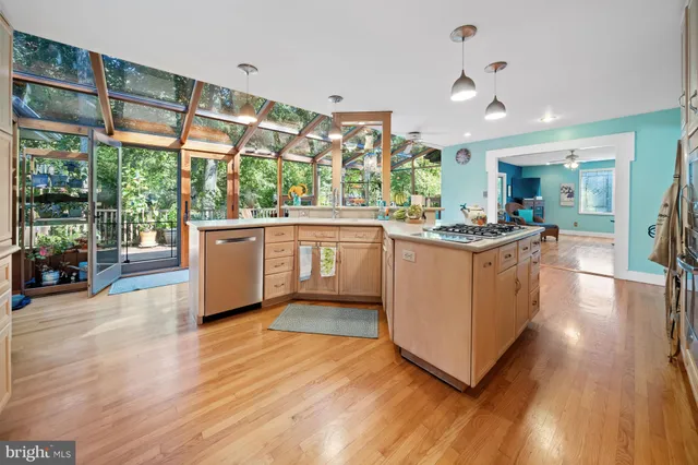a kitchen with stainless steel appliances granite countertop a stove and cabinets