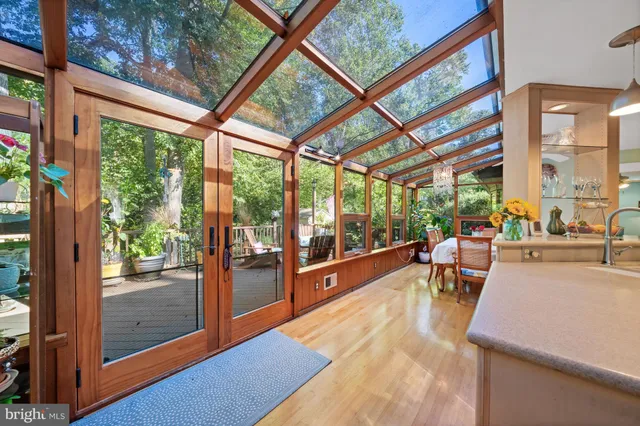 a view of a porch with chairs and couches