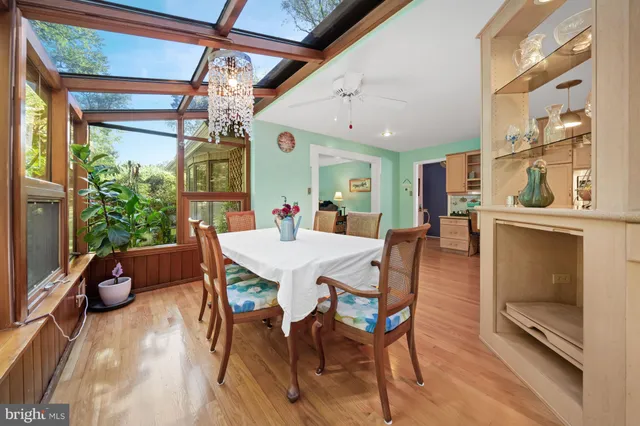a view of a dining room with furniture and a window