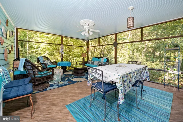 a spacious bedroom with a bed and a flat screen tv