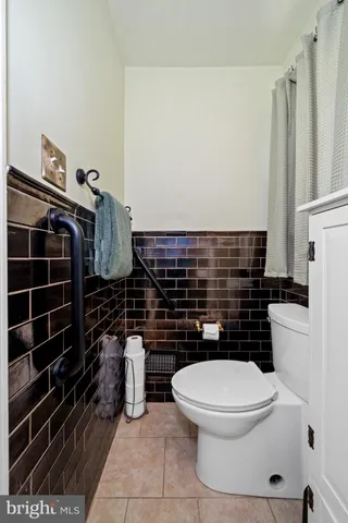 a bathroom with a sink a mirror and a shower curtain