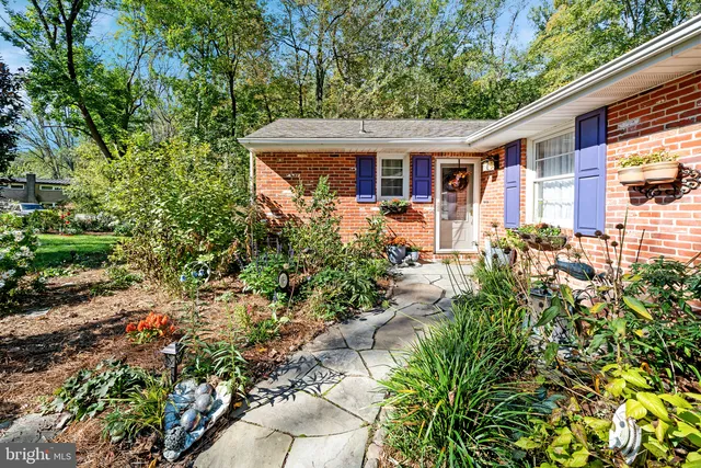 a view of a house with potted plants