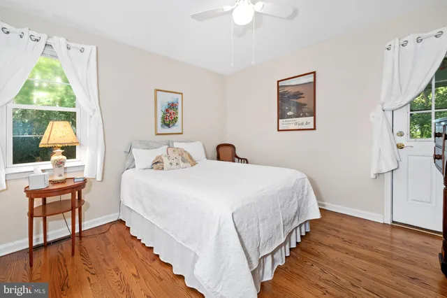 a living room with furniture and a dresser