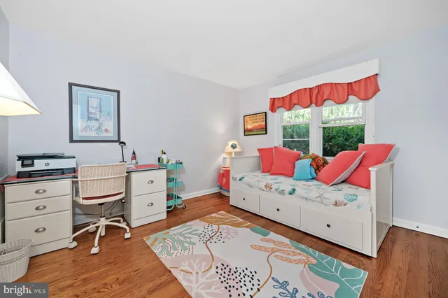 a bathroom with a sink a toilet and a large mirror