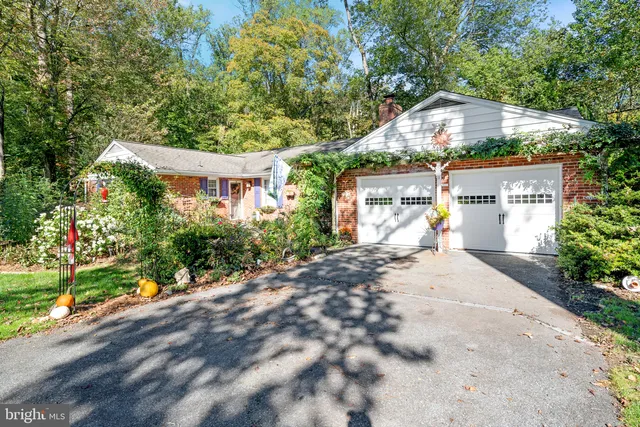 an aerial view of a house with a yard and hanging chair