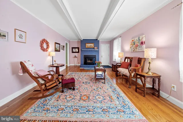 a living room with furniture and a rug