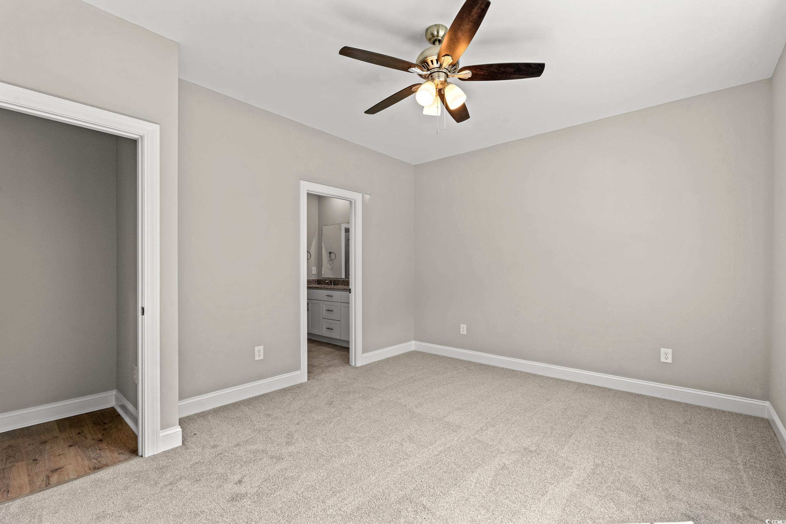 344 Kiskadee Loop, Unit B Conway, SC 29526 - Photo 11 of 32 Unfurnished bedroom featuring light colored carpet