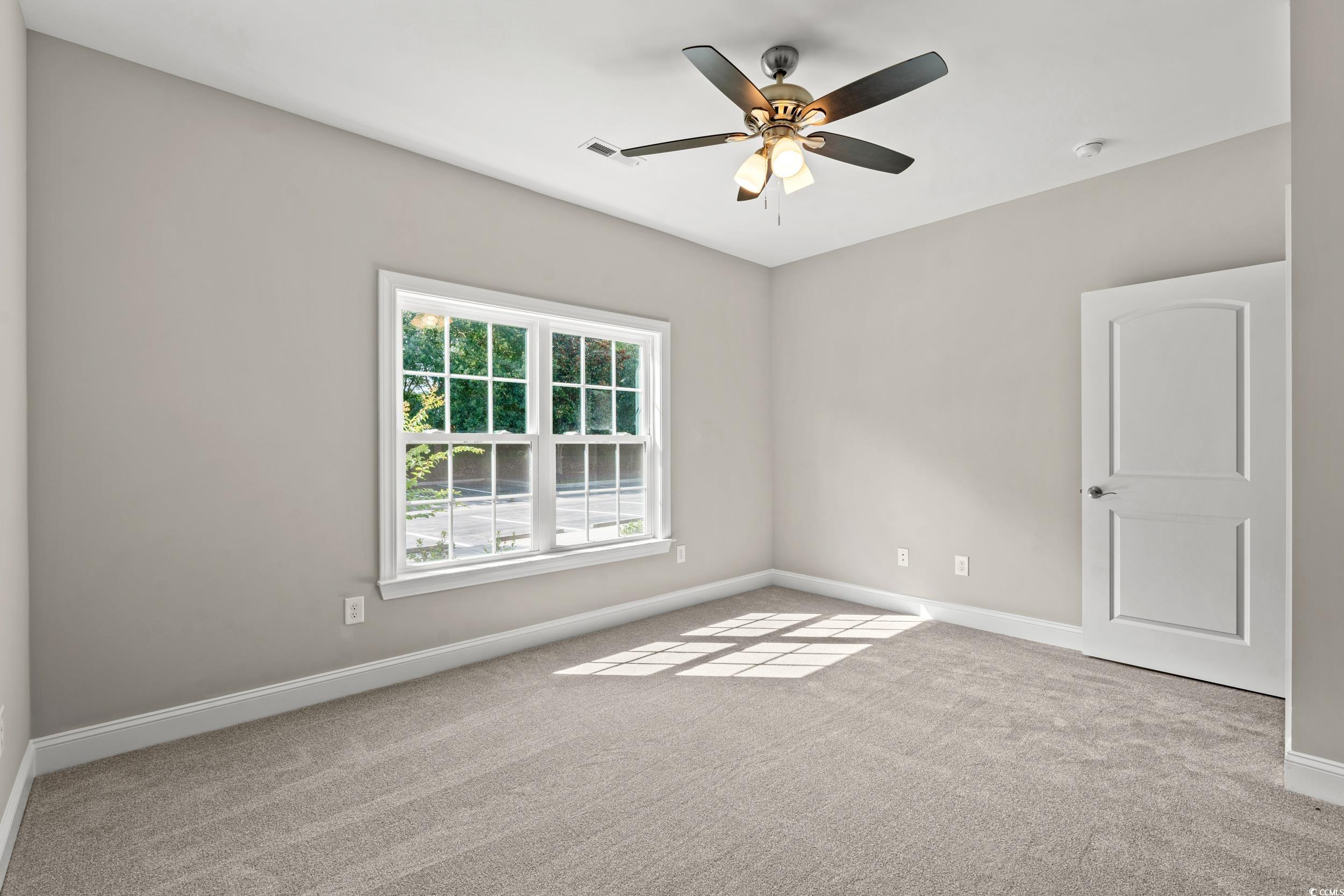 344 Kiskadee Loop, Unit B Conway, SC 29526 - Photo 17 of 32 Carpeted empty room featuring ceiling fan