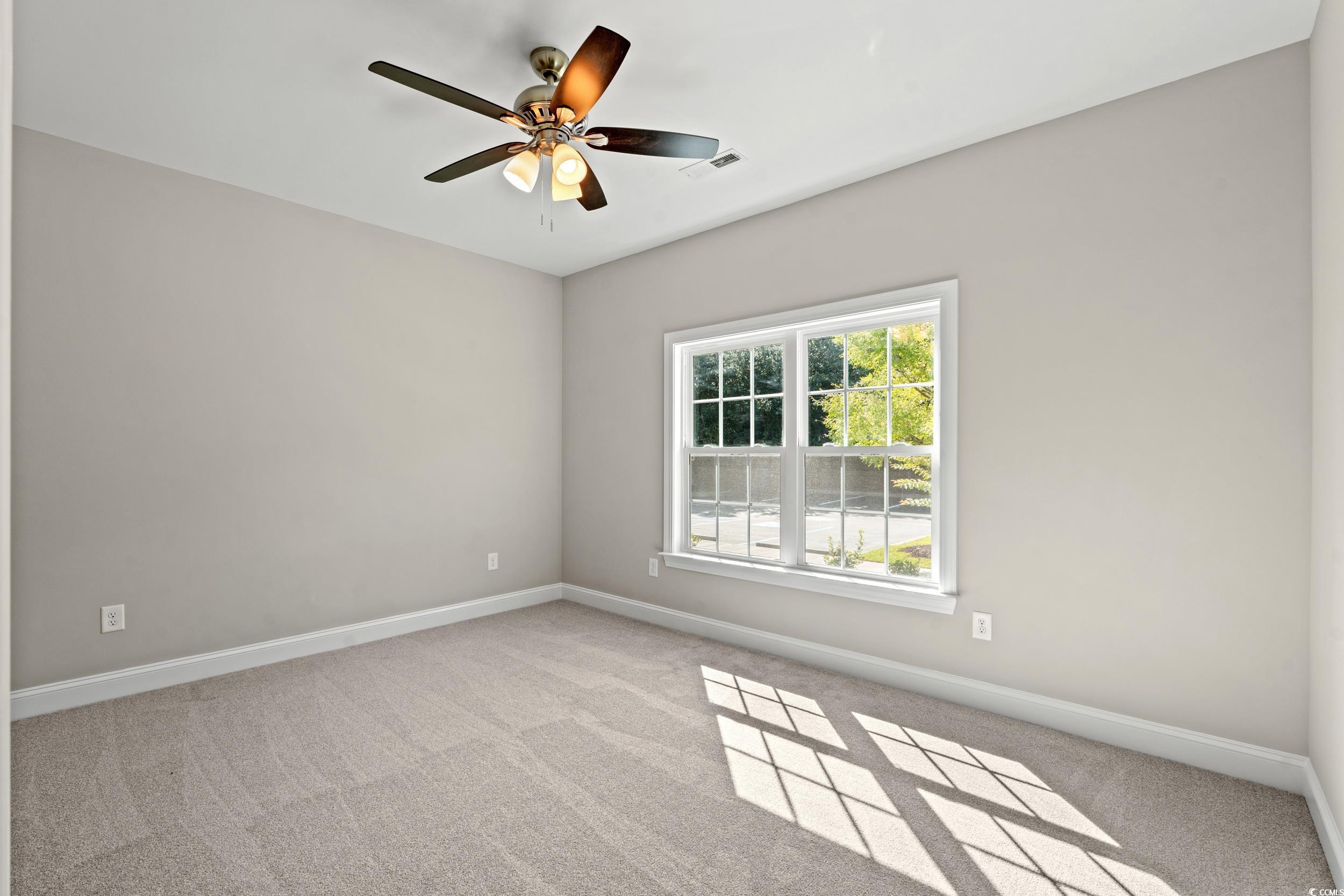 344 Kiskadee Loop, Unit B Conway, SC 29526 - Photo 19 of 32 Spare room featuring light carpet and ceiling fan