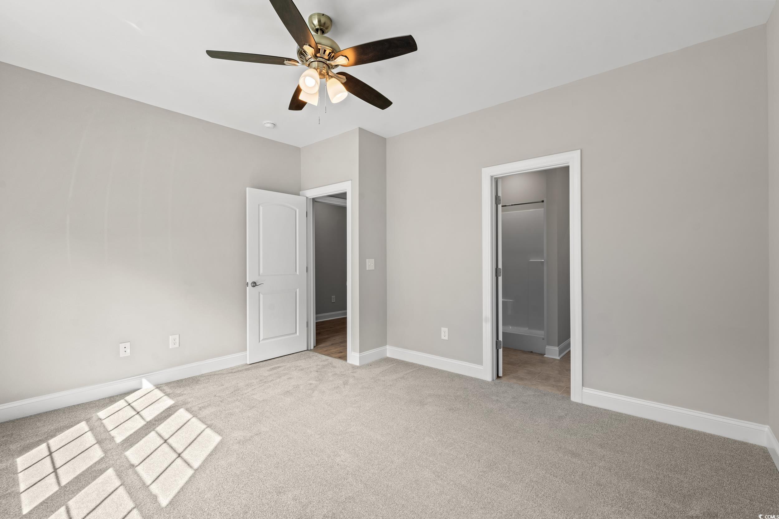 344 Kiskadee Loop, Unit B Conway, SC 29526 - Photo 23 of 32 Unfurnished bedroom with a spacious closet, light