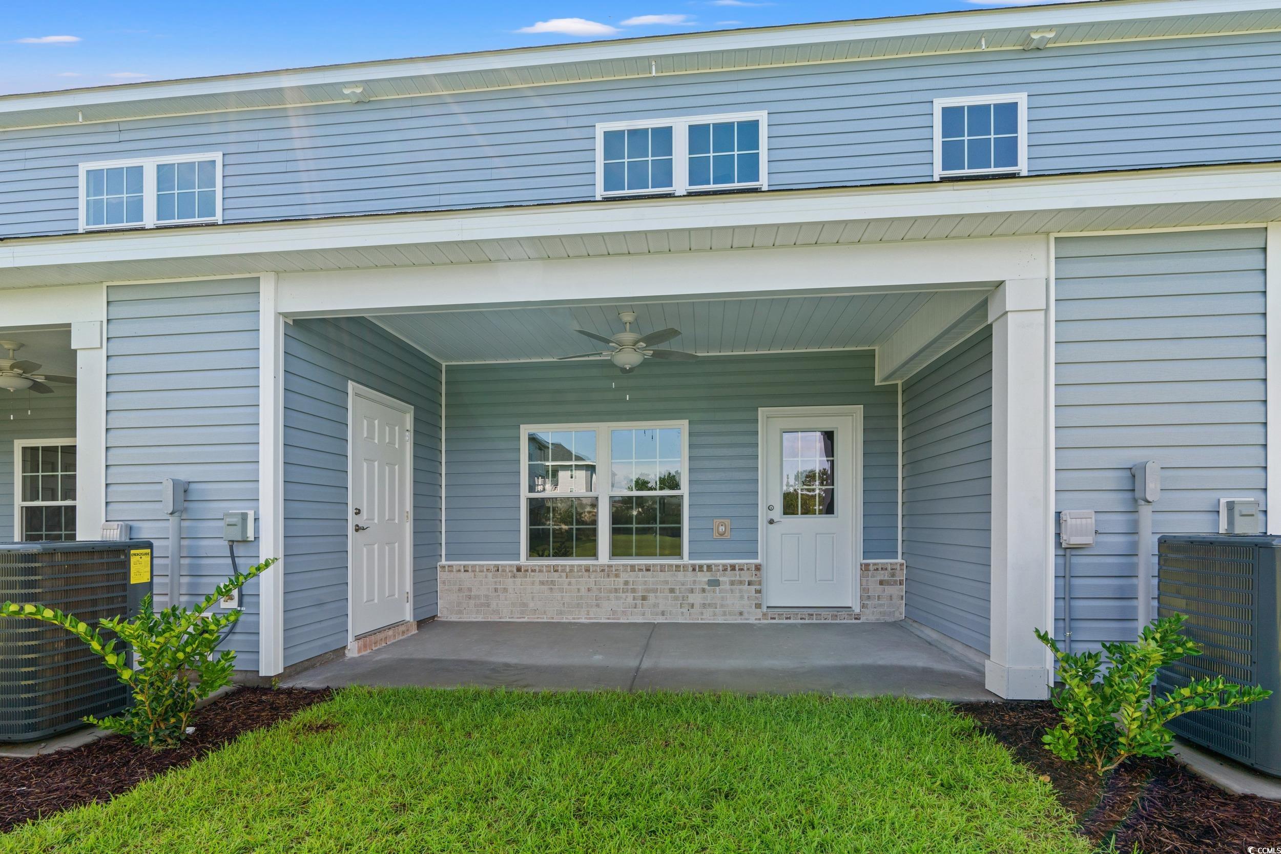 344 Kiskadee Loop, Unit B Conway, SC 29526 - Photo 27 of 32 Doorway to property featuring central AC and ceili