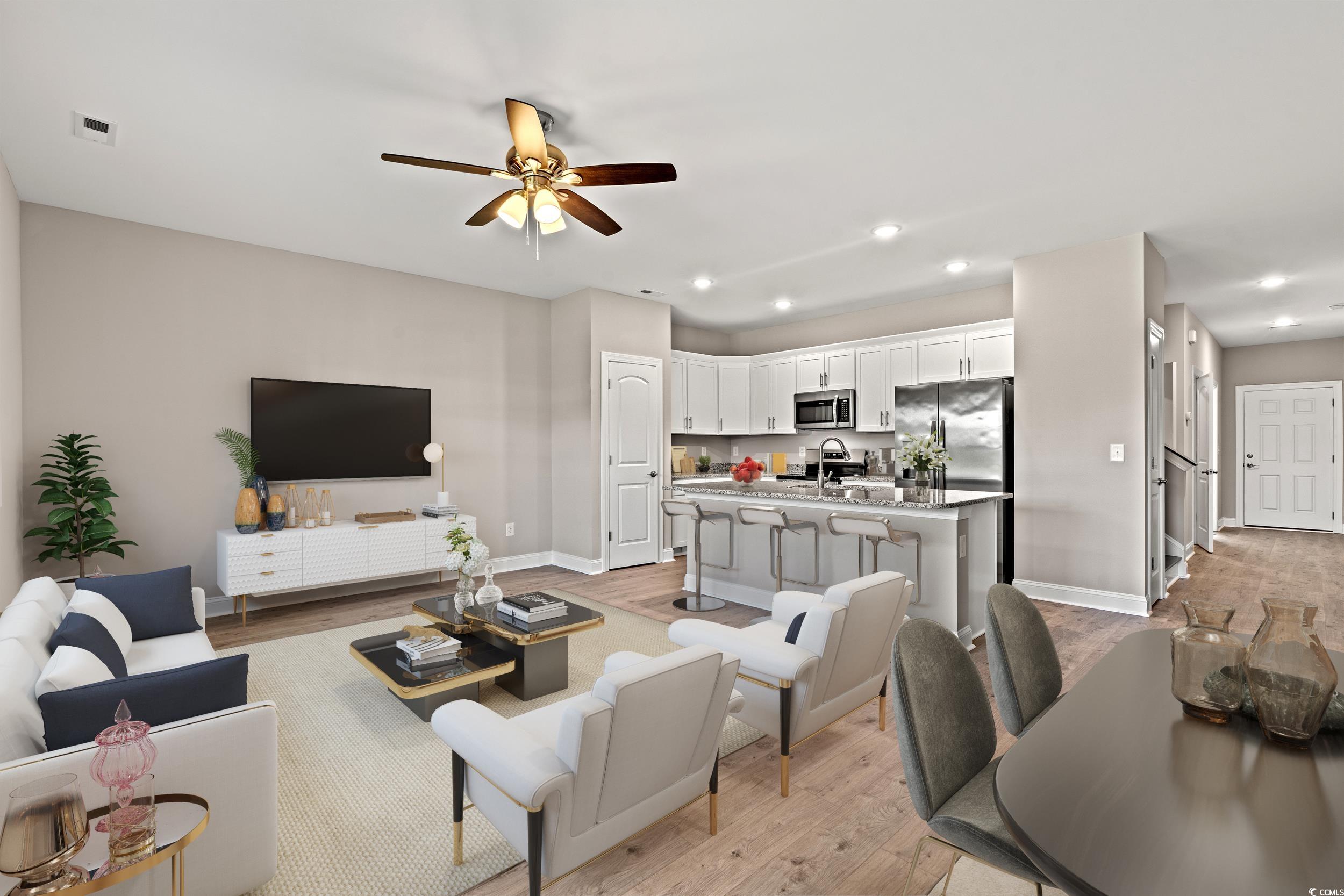 344 Kiskadee Loop, Unit B Conway, SC 29526 - Photo 3 of 32 Living room featuring light hardwood / wood-style