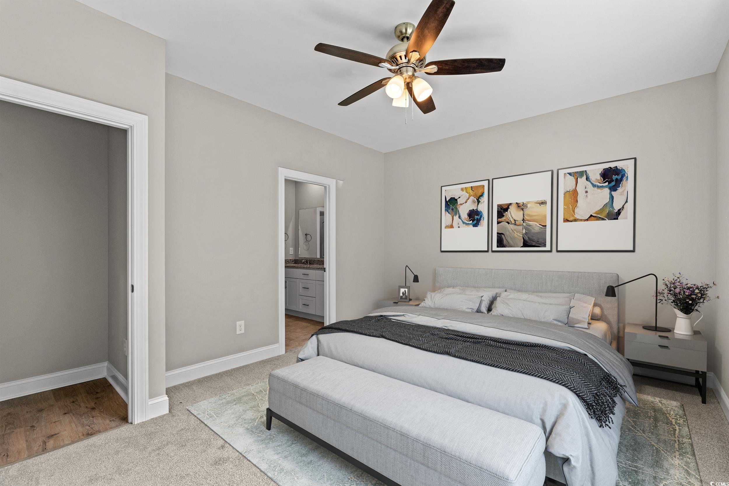 344 Kiskadee Loop, Unit B Conway, SC 29526 - Photo 10 of 32 Carpeted bedroom with ensuite bath and ceiling fan