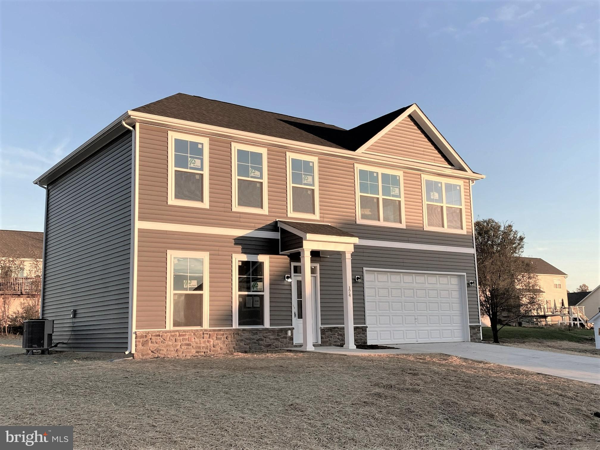 174 Constellation Road Inwood, WV 25428 - Photo 1 of 1 a front view of a house with a yard
