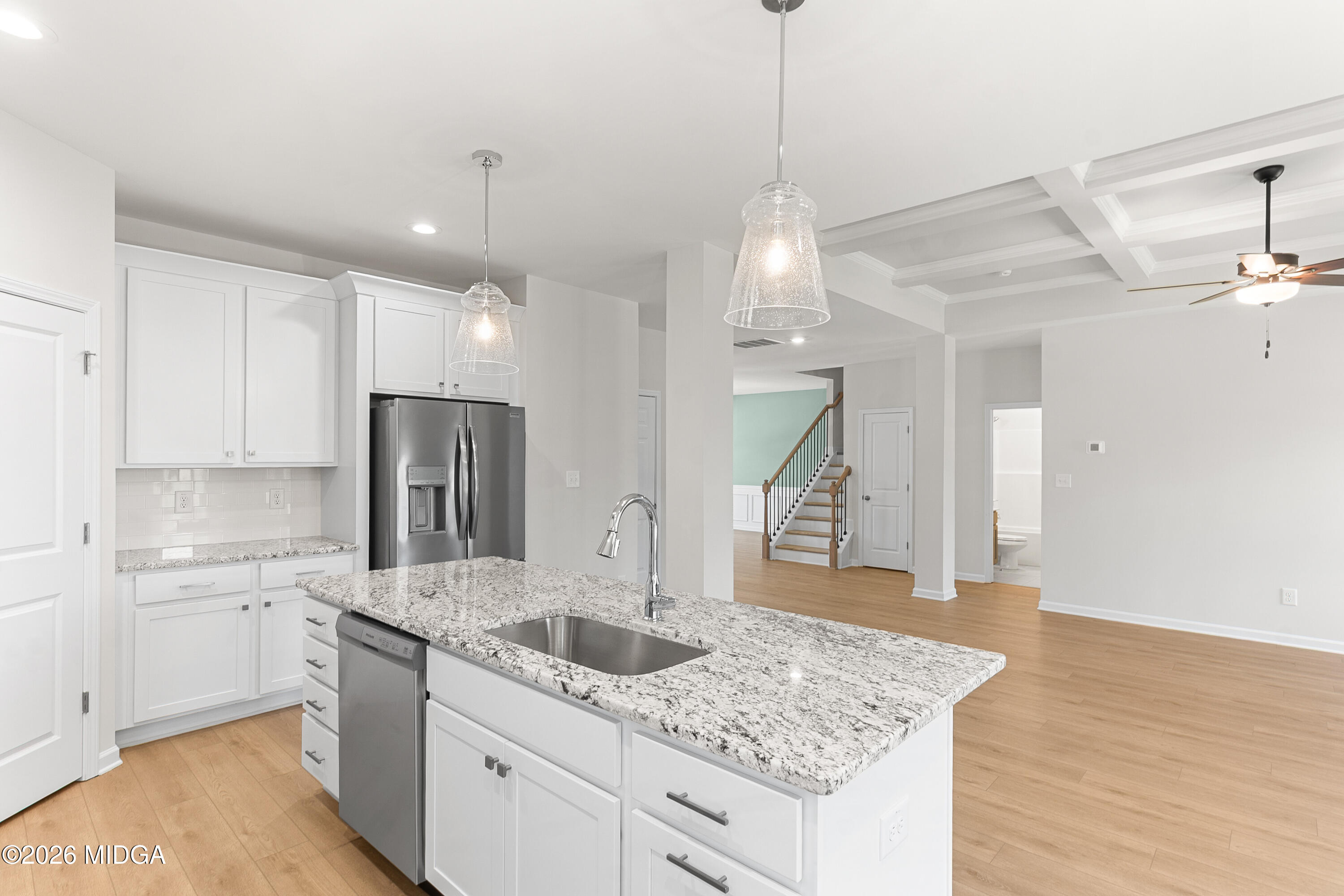 5393 Felles Way, Unit 359 Forsyth, GA 31029 - Photo 18 of 54 a kitchen with stainless steel appliances granite countertop a sink a refrigerator and a stove