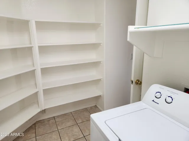 a bedroom with a bed and a cabinets