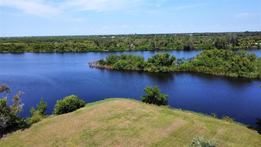 an aerial view of a house with a lake view