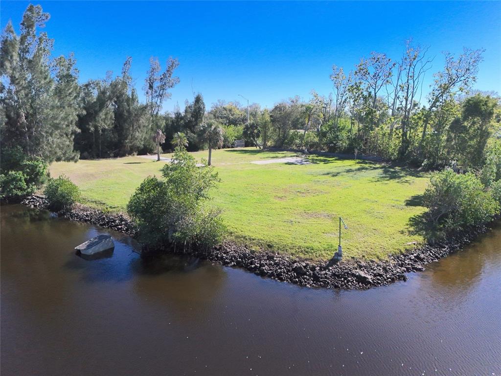 29530 Shell Creek Court Punta Gorda, FL 33982 - Photo 2 of 19 a view of a lake with a yard