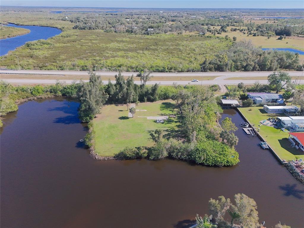 29530 Shell Creek Court Punta Gorda, FL 33982 - Photo 3 of 19 an aerial view of lake residential house with outdoor space