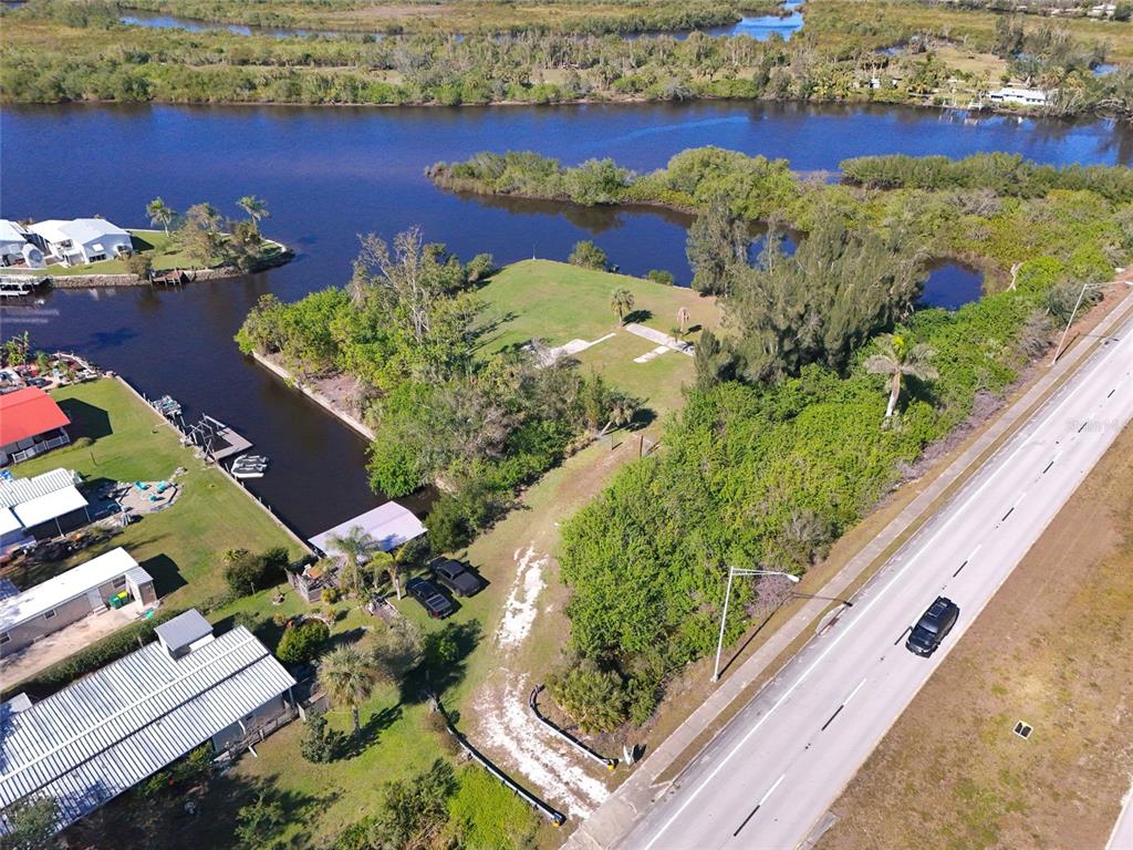 29530 Shell Creek Court Punta Gorda, FL 33982 - Photo 7 of 19 a view of a lake with a building in the background