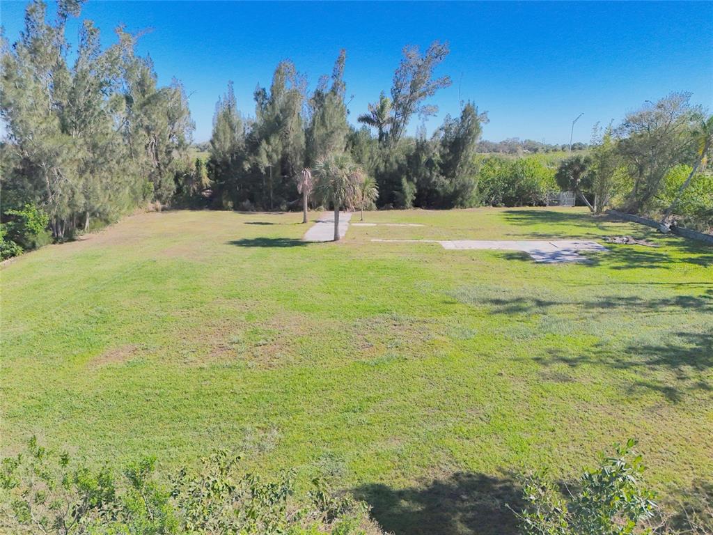 29530 Shell Creek Court Punta Gorda, FL 33982 - Photo 9 of 19 a view of a field with trees in the background
