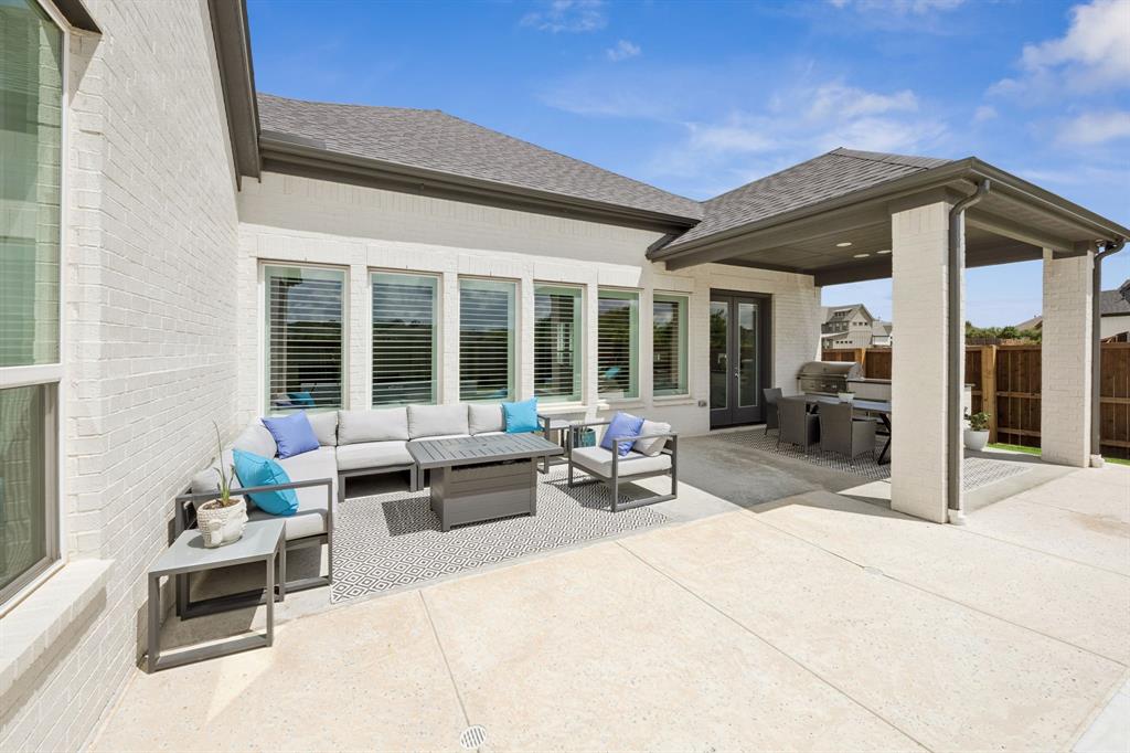 7024 Prairie Ridge Road Argyle, TX 76226 - Photo 33 of 40 Large Covered Patio Offers a Seamless Outdoor Cooking and Dining Experience
