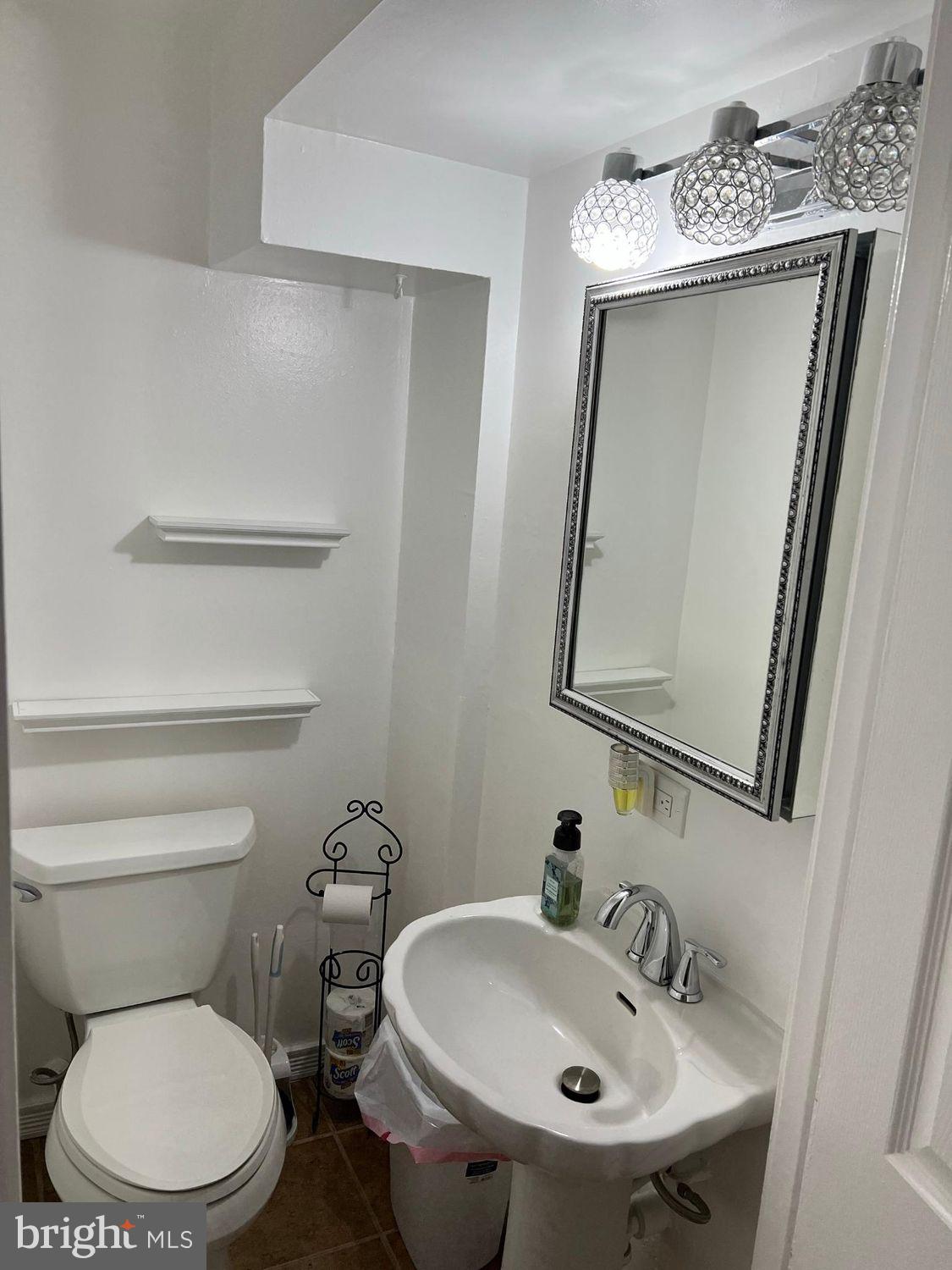 7620 Burnside Road Landover, MD 20785 - Photo 14 of 31 Half Bath with glam on the main level .