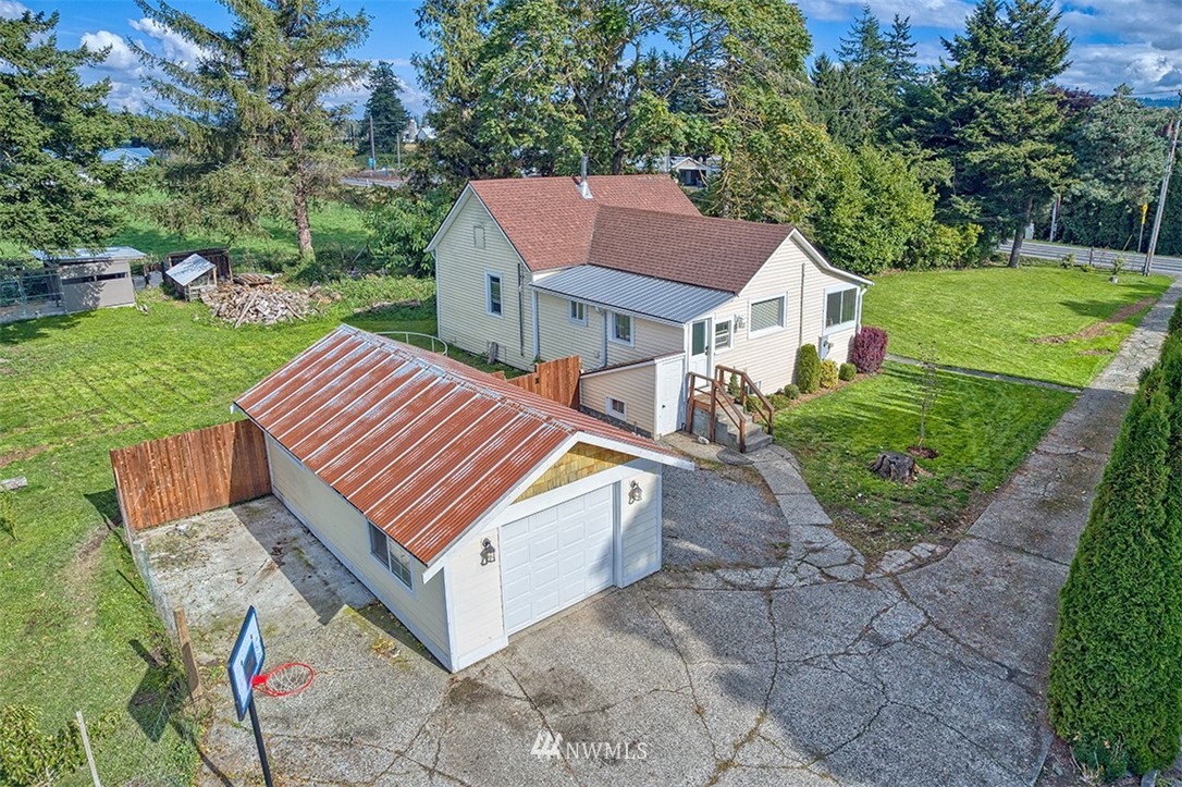 8263 Nooksack Road Everson, WA 98247 - Photo 2 of 36 an aerial view of a house with a yard