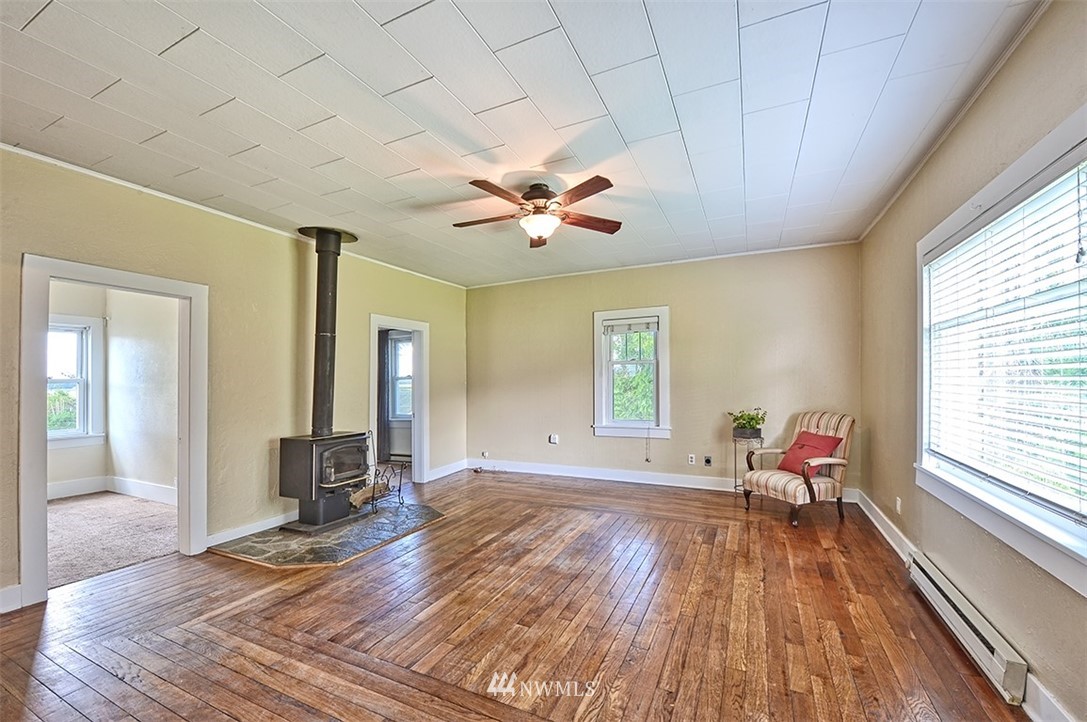 8263 Nooksack Road Everson, WA 98247 - Photo 11 of 36 a living room with furniture and a large window