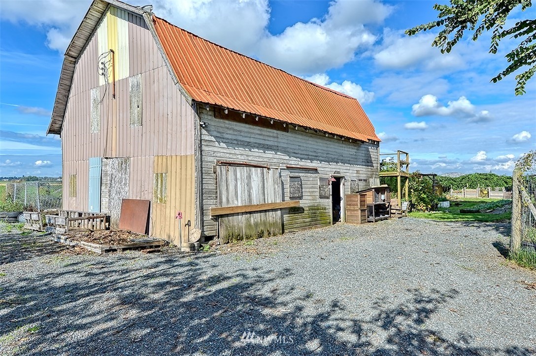 8263 Nooksack Road Everson, WA 98247 - Photo 24 of 36 a view of a house with a patio