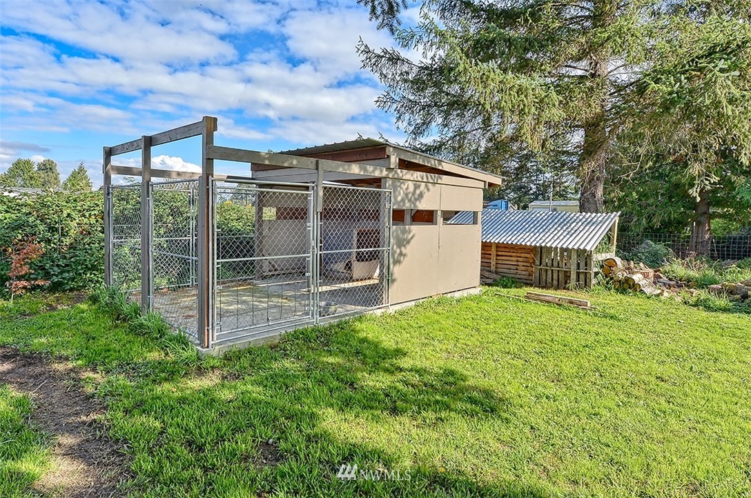 8263 Nooksack Road Everson, WA 98247 - Photo 35 of 36 a view of a house with backyard and garden